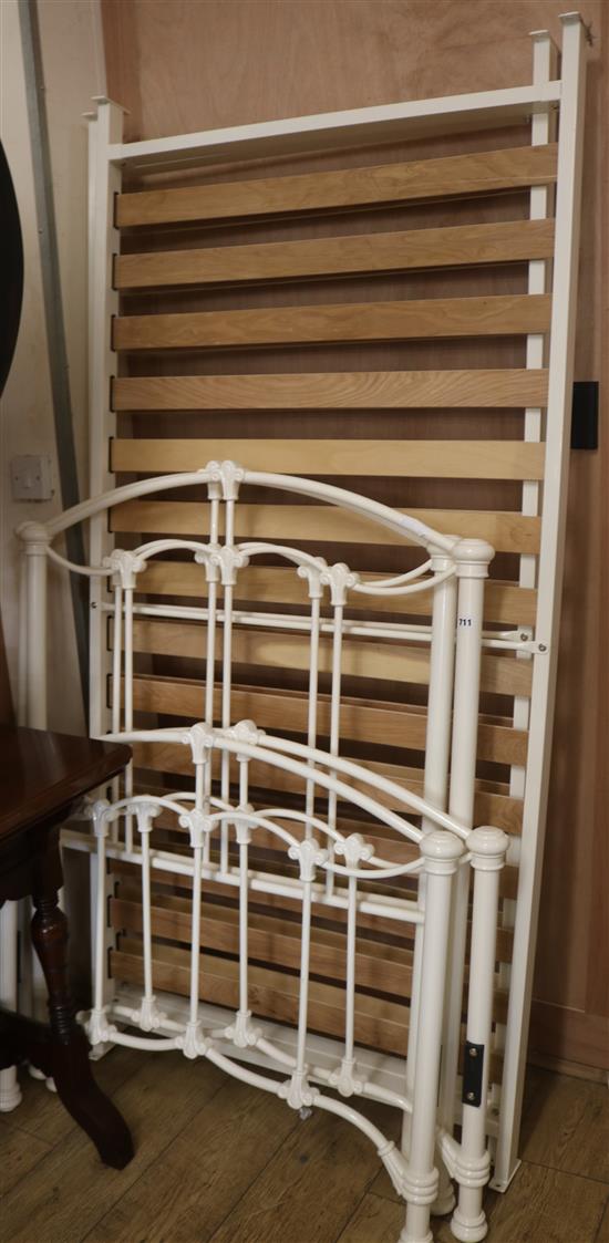 A pair of cream metal bed frames, W.92cm